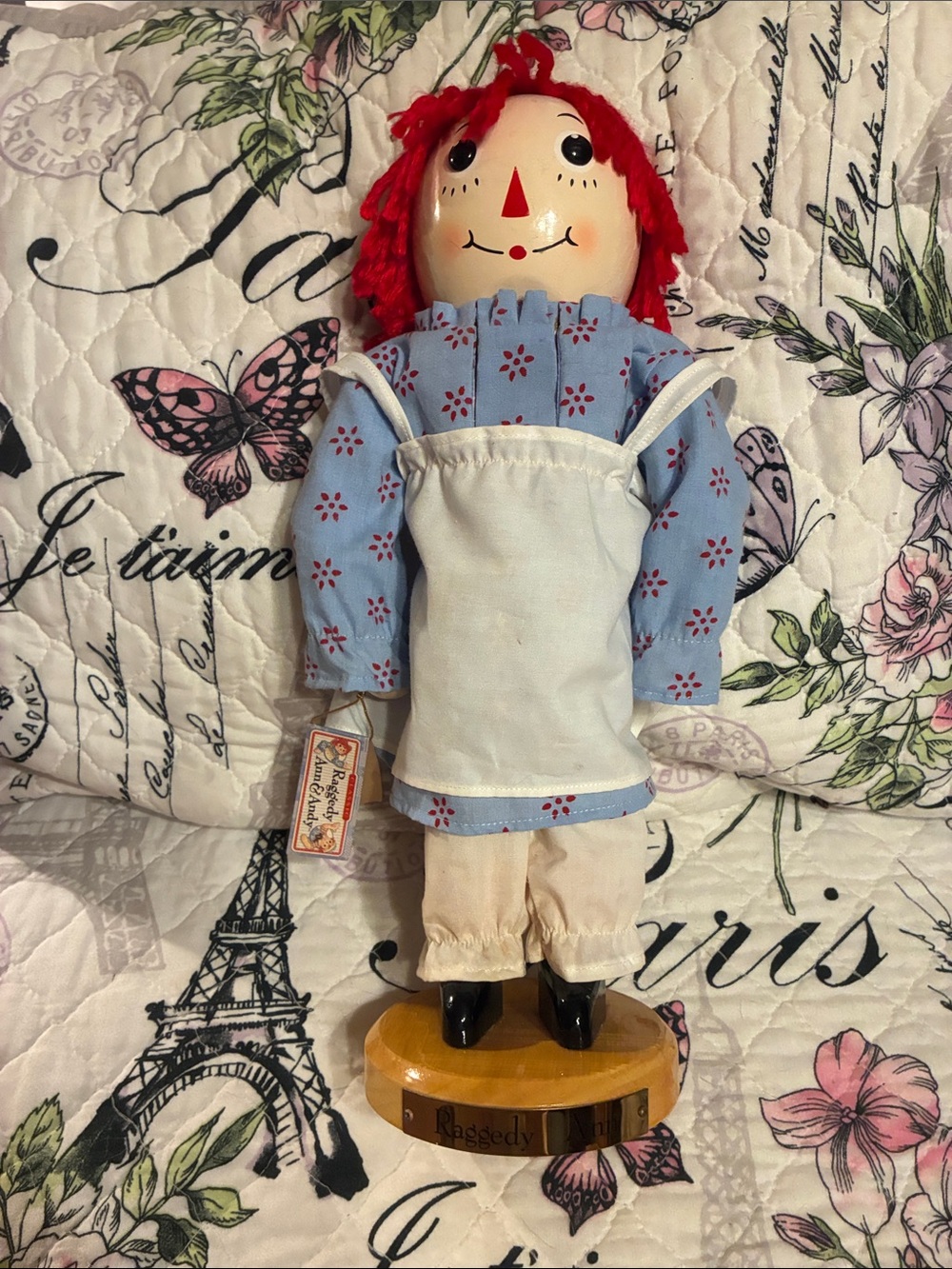 Red-Haired Wood Doll in Blue Floral Outfit with White Apron